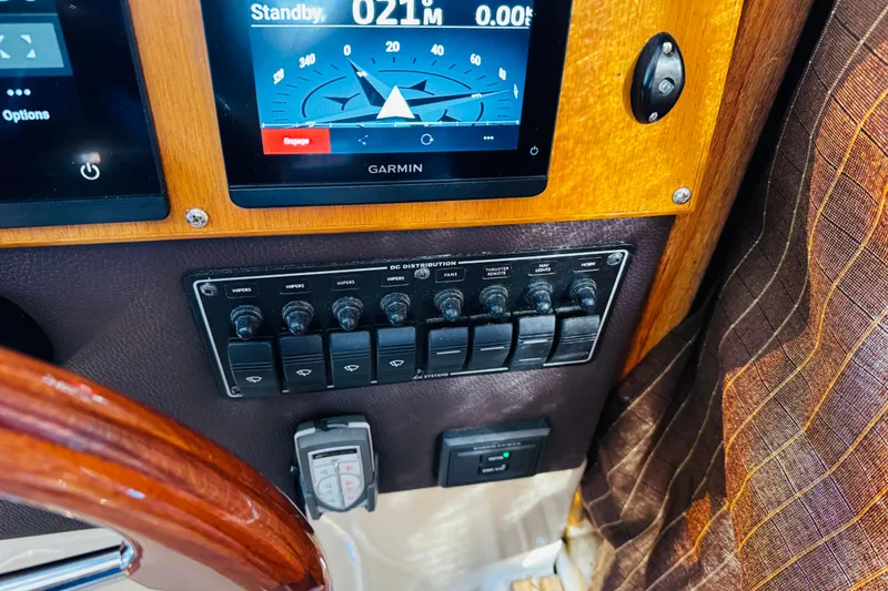 Slide: The Image of Control panel of a 2012 Ranger Tugs R-31 with Garmin navigation display. - 9