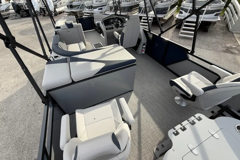 Slide: The Image of 2026 Avalon 2385 LSZ Rear Fish Tri Toon boat interior with seating and helm. - 15