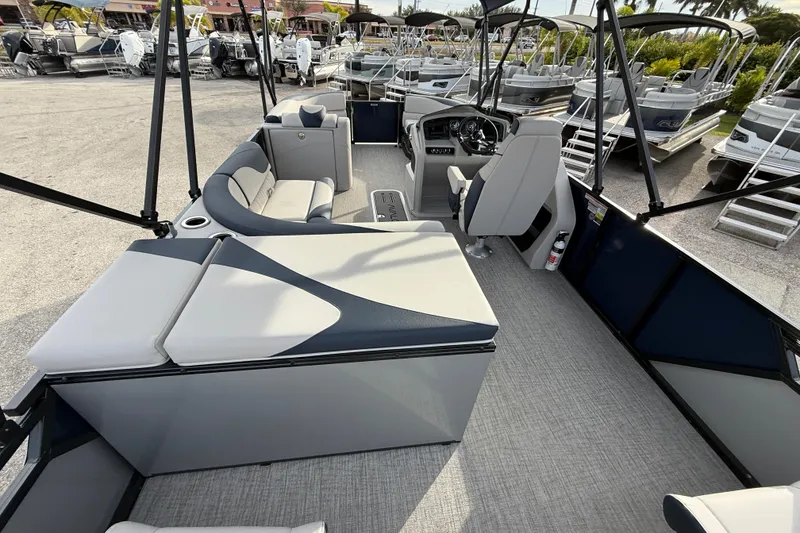 Slide: The Image of 2026 Avalon 2385 LSZ Rear Fish Tri Toon boat interior with seating and helm. - 16