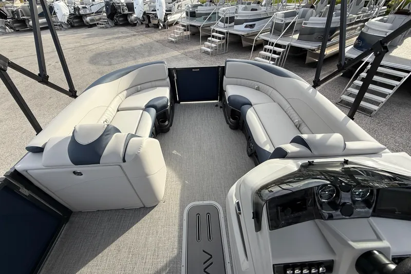 Slide: The Image of 2026 Avalon 2385 LSZ Rear Fish Tri Toon interior with plush seating and modern dashboard. - 18