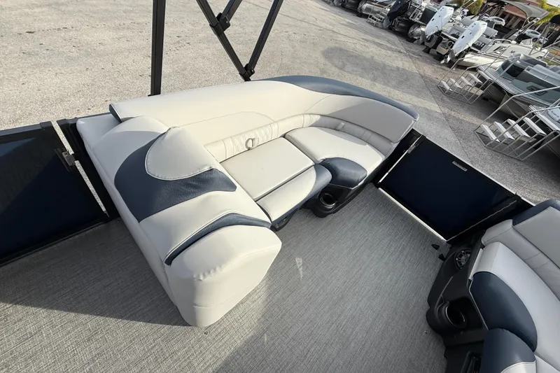 Slide: The Image of 2026 Avalon 2385 LSZ Tri Toon boat interior with plush seating and high-performance design. - 19