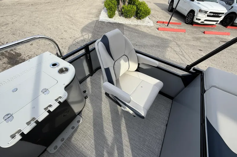 Slide: The Image of 2026 Avalon 2385 LSZ Rear Fish Tri Toon boat interior with captain's chair and console. - 25