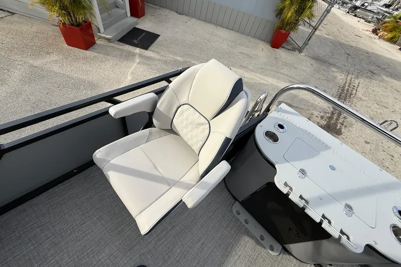 Slide: The Image of Luxurious seating on 2026 Avalon 2385 LSZ Rear Fish Tri Toon boat, featuring high-performance design. - 26