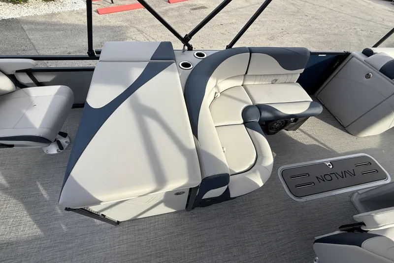 Slide: The Image of 2026 Avalon 2385 LSZ Rear Fish Tri Toon interior with plush seating and modern design. - 27