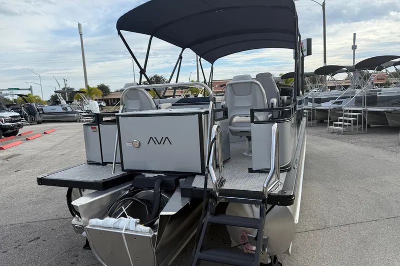 Slide: The Image of 2026 Avalon 2385 LSZ Rear Fish Tri Toon boat with canopy, parked in a marina. - 8