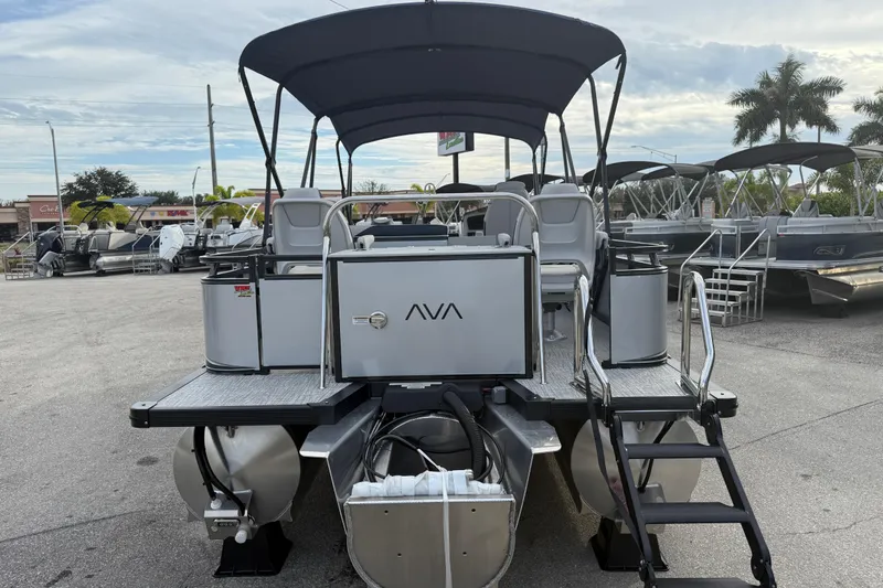 Slide: The Image of 2026 Avalon 2385 LSZ Rear Fish Tri Toon boat with canopy in a marina setting. - 9