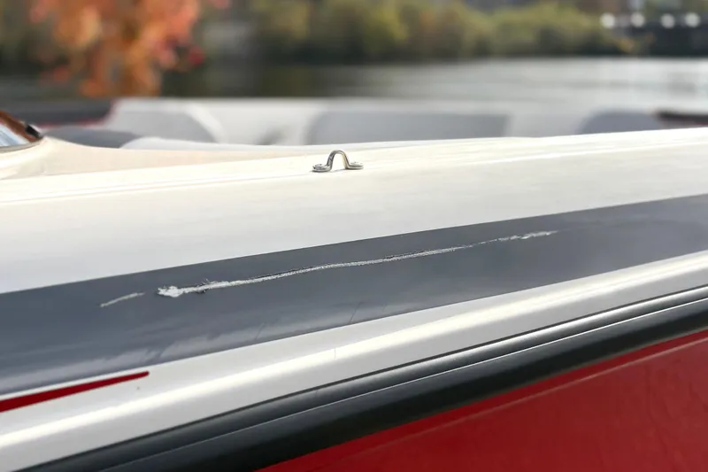 Slide: The Image of 2022 Bayliner Element M15 boat with visible scratch on the side. - 16