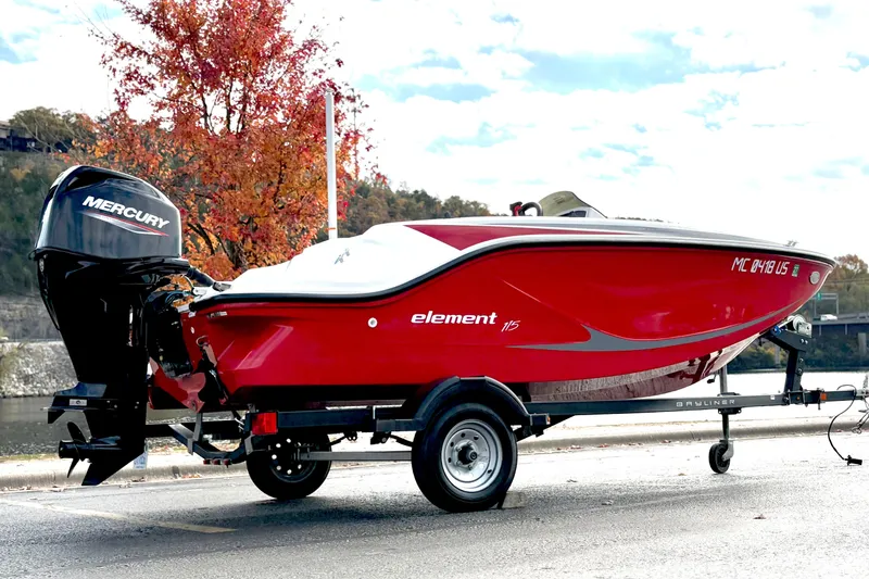 Slide: The Image of 2022 Bayliner Element M15 boat on trailer with Mercury engine, autumn background. - 2