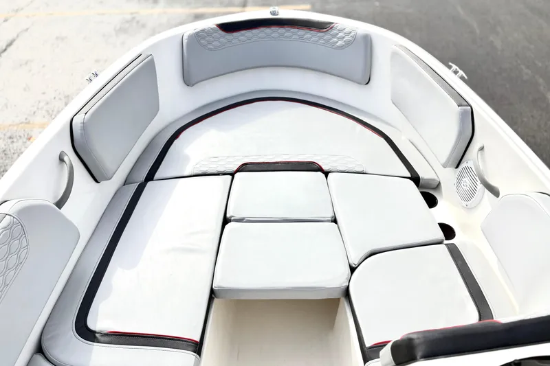 Slide: The Image of 2022 Bayliner Element M15 boat interior with cushioned seating and modern design. - 20