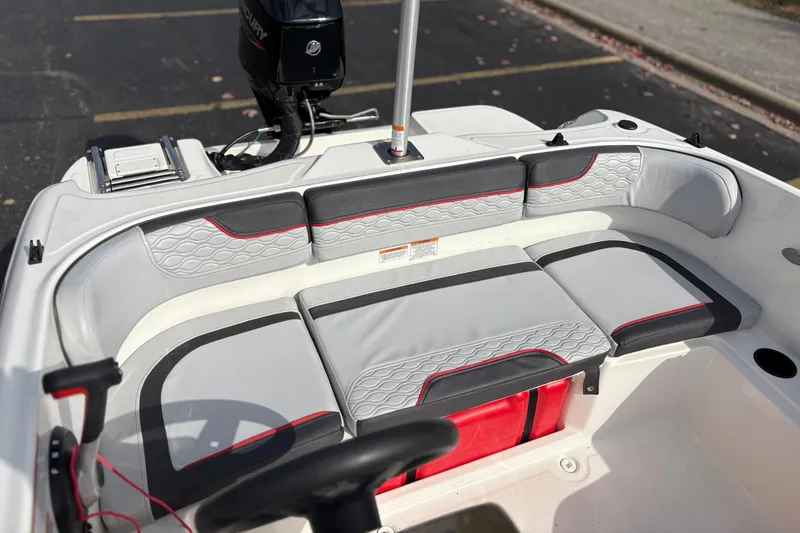 Slide: The Image of 2022 Bayliner Element M15 boat interior with stylish seating and Mercury engine. - 21