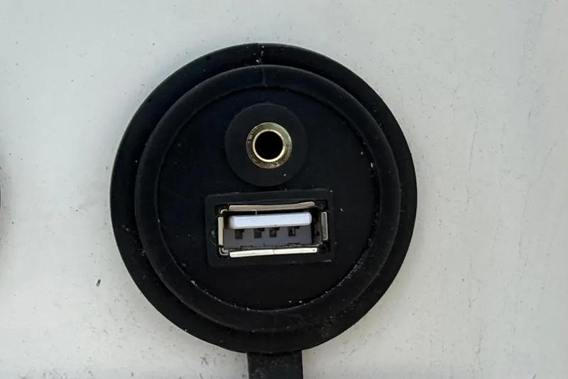 Slide: The Image of USB and audio port on 2022 Bayliner Element M15 boat. - 25