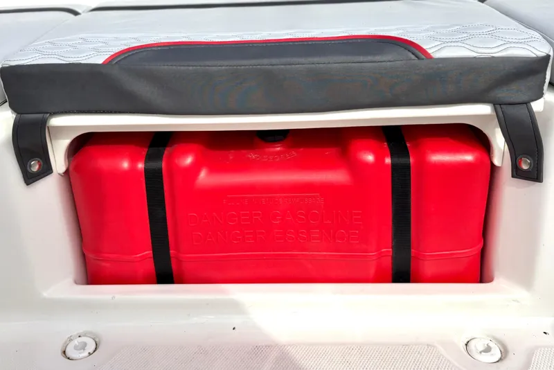 Slide: The Image of Red gasoline tank in a 2022 Bayliner Element M15 boat storage compartment. - 32