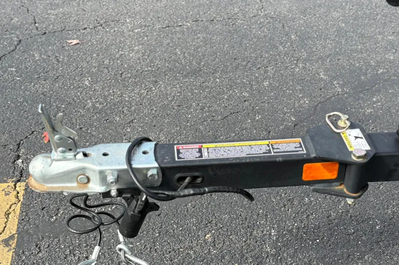 Slide: The Image of Trailer hitch of 2022 Bayliner Element M15 on asphalt surface. - 40