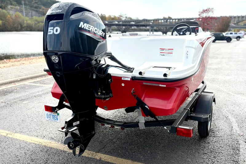 Slide: The Image of 2022 Bayliner Element M15 boat with Mercury 50 engine on trailer. - 6