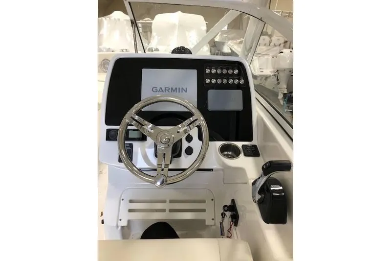 Slide: The Image of 2018 Edgewater 248CX Crossover boat dashboard with Garmin navigation system. - 4
