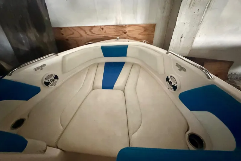Slide: The Image of Interior view of 2018 Chaparral 21 H2O Sport boat with blue and beige seating. - 5