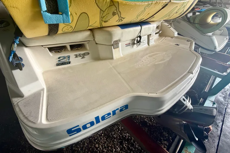 Slide: The Image of 2018 Chaparral 21 H2O Sport boat rear view with "Solera" branding. - 8
