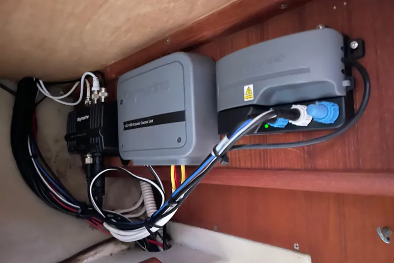 Slide: The Image of Electrical components and wiring inside a 1989 Hunter 35.5 model boat. - 21