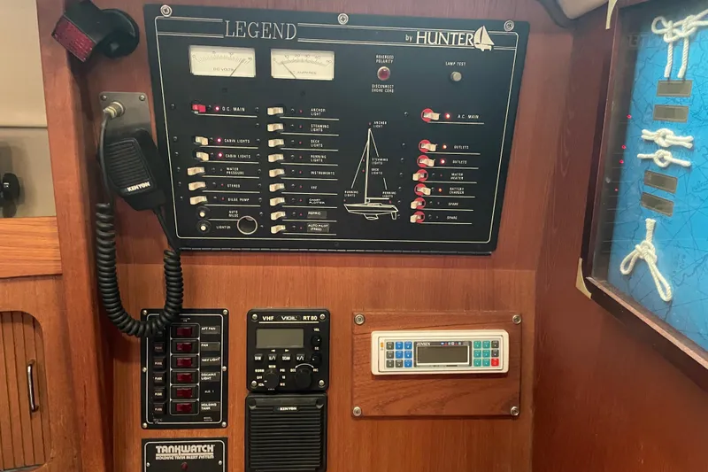 Slide: The Image of Control panel of a 1989 Hunter 35.5 sailboat with navigation and communication equipment. - 22