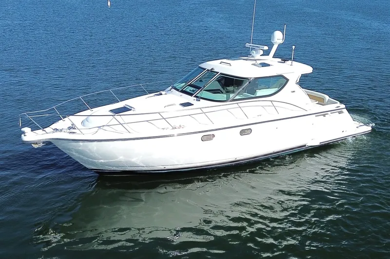 The Image of 2006 Tiara Yachts Sovran cruising on calm blue waters. - 0