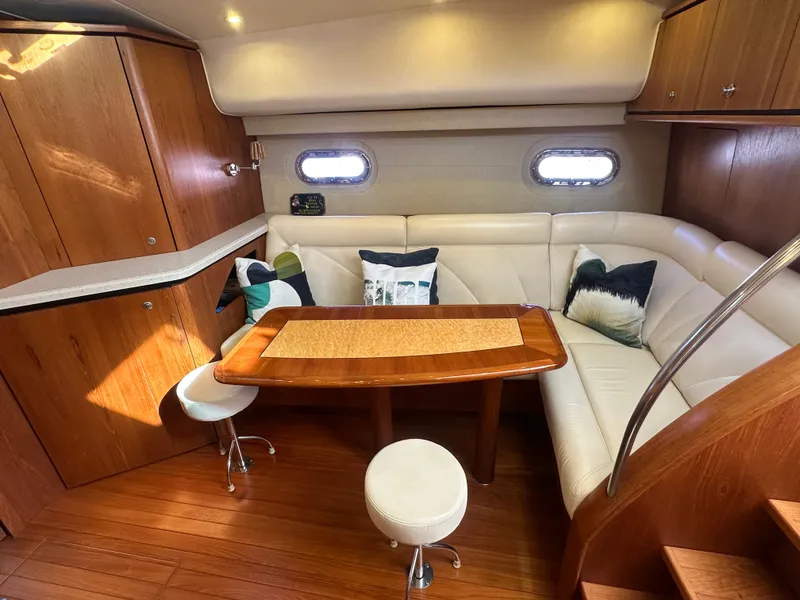 Slide: The Image of 2006 Tiara Yachts Sovran interior with elegant wood finish and cozy seating area. - 17