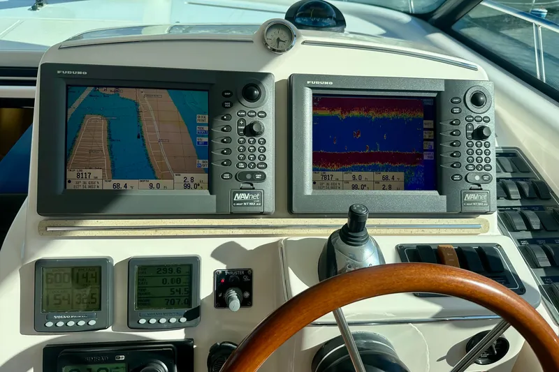 Slide: The Image of 2006 Tiara Yachts Sovran dashboard with navigation and control systems. - 23