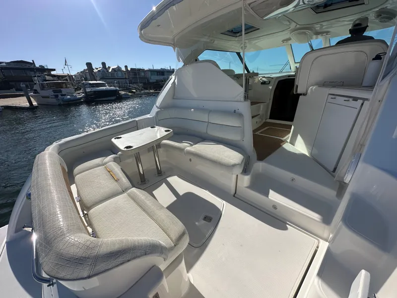 Slide: The Image of 2006 Tiara Yachts Sovran interior with seating area, table, and marina view. - 24