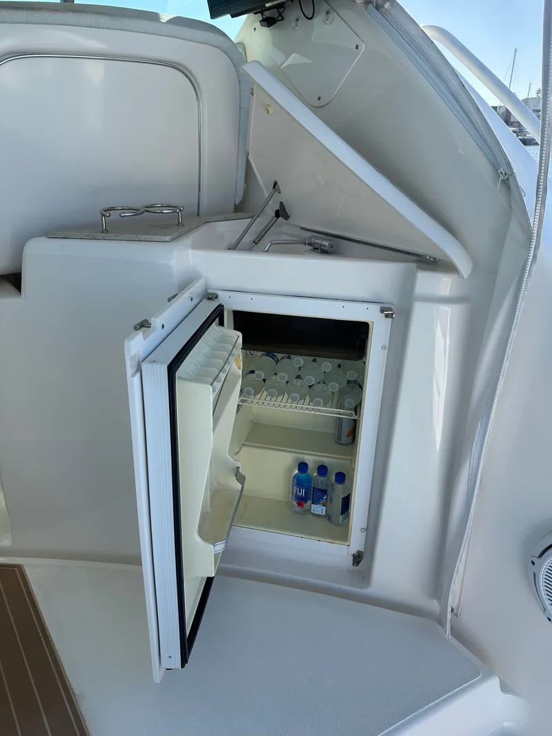 Slide: The Image of Open mini fridge on 2006 Tiara Yachts Sovran, stocked with drinks. - 27