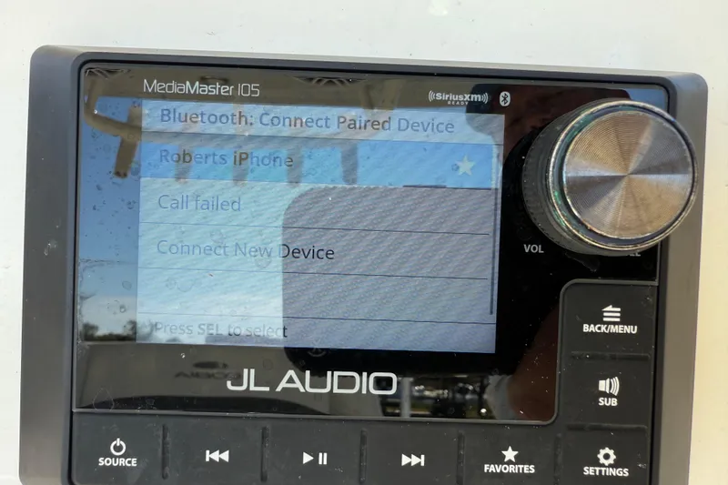Slide: The Image of JL Audio MediaMaster 105 display on 2023 Cobia 240CC, showing Bluetooth connection options. - 18