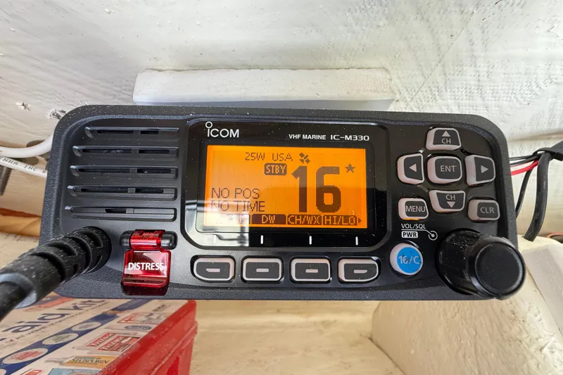 Slide: The Image of VHF marine radio on 2023 Cobia 240CC boat, displaying channel 16. - 19