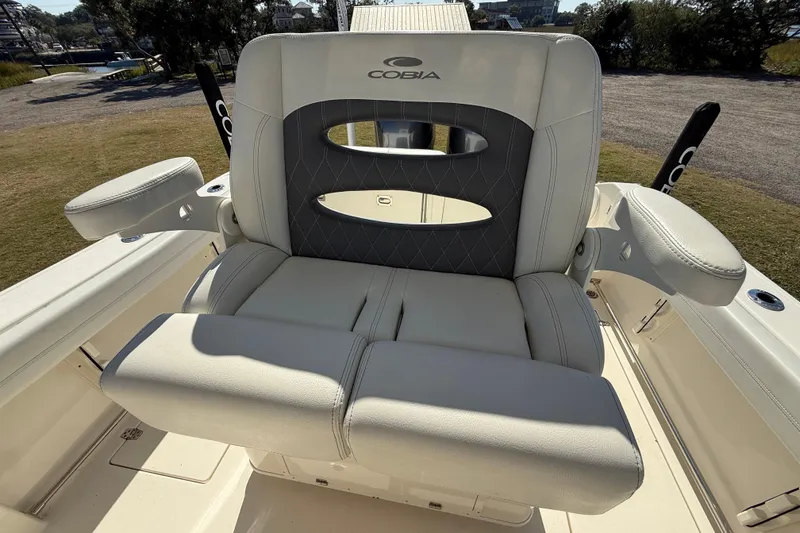 Slide: The Image of 2023 Cobia 240CC boat seat with armrests, featuring elegant design and comfort. - 20