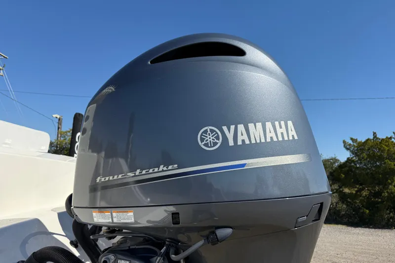 Slide: The Image of Yamaha four-stroke engine on 2023 Cobia 240CC boat under clear blue sky. - 6