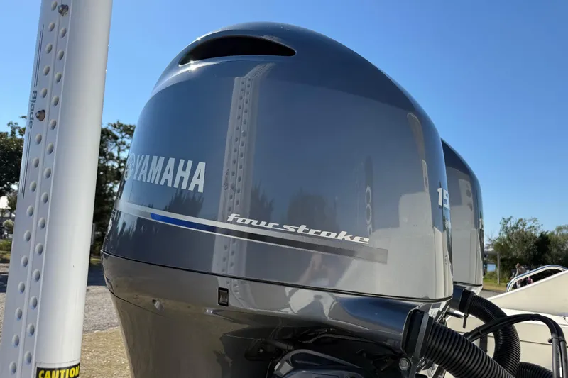 Slide: The Image of Yamaha four-stroke engine on 2023 Cobia 240CC boat under clear blue sky. - 7