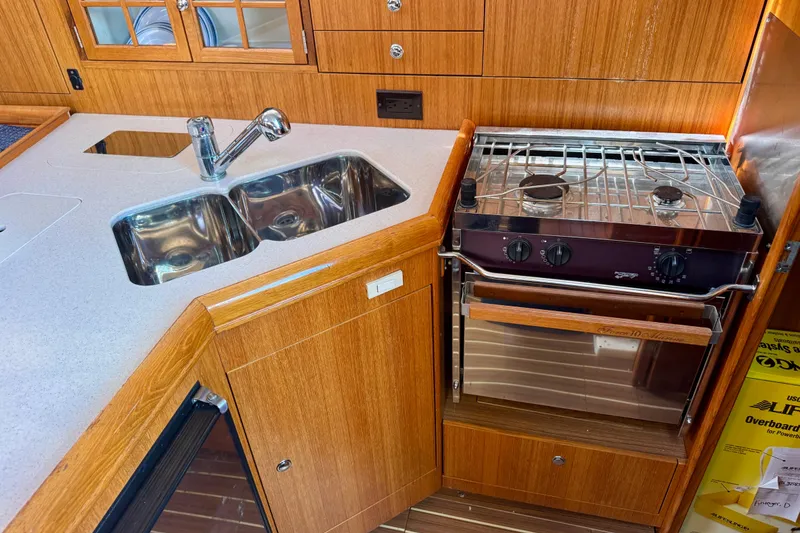 Slide: The Image of 2003 Hunter 36 yacht kitchen with dual sink and stove. - 10