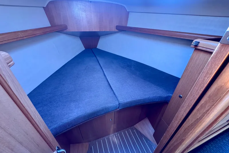 Slide: The Image of Interior cabin of a 2003 Hunter 36 sailboat with cozy V-berth. - 13
