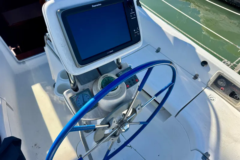 Slide: The Image of Steering wheel and navigation system on 2003 Hunter 36 sailboat cockpit. - 18