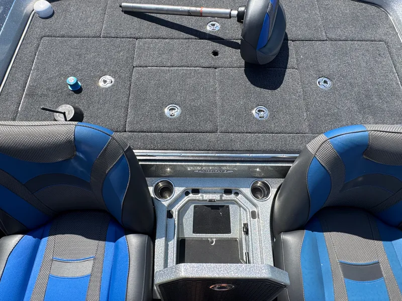 Slide: The Image of 2019 Ranger Z520L boat interior with blue seats and fishing rod holder. - 24