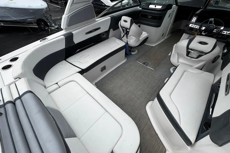 Slide: The Image of 2020 Chaparral 277 SSX boat interior with luxurious seating and modern dashboard. - 12