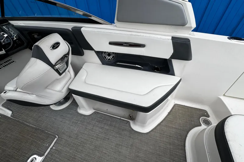 Slide: The Image of Interior of 2020 Chaparral 277 SSX boat with white seating and modern dashboard. - 13