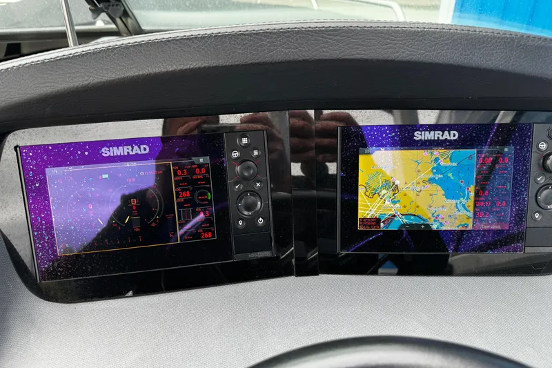 Slide: The Image of Simrad navigation displays on 2020 Chaparral 277 SSX boat dashboard. - 22