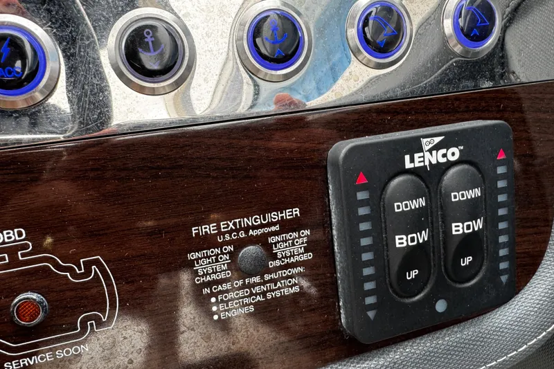 Slide: The Image of Control panel of a 2020 Chaparral 277 SSX boat with Lenco trim tab switches. - 33