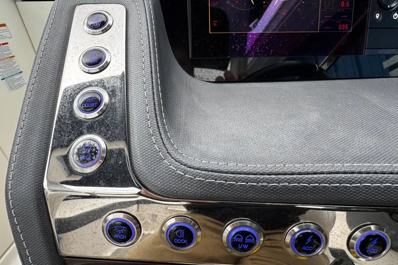 Slide: The Image of Control panel of a 2020 Chaparral 277 SSX boat with illuminated buttons. - 35