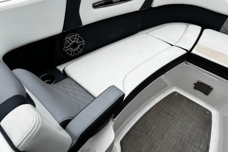 Slide: The Image of 2020 Chaparral 277 SSX boat interior with cushioned seating and speaker. - 38