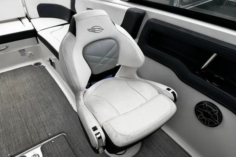 Slide: The Image of 2020 Chaparral 277 SSX boat interior with white captain's chair and speaker. - 45
