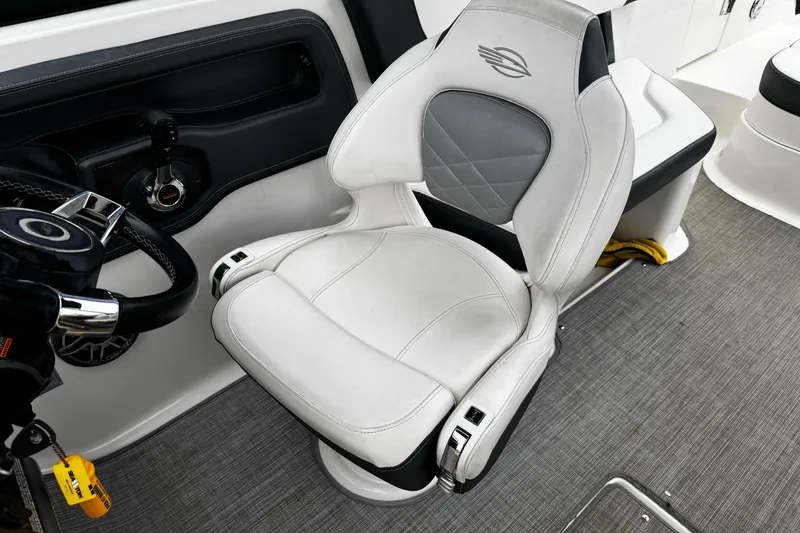 Slide: The Image of Captain's seat in 2020 Chaparral 277 SSX boat, featuring sleek design and premium materials. - 47