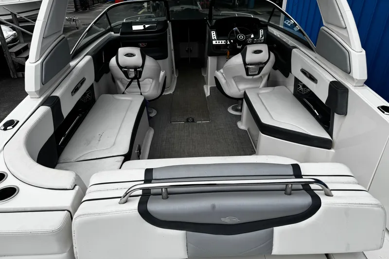 Slide: The Image of 2020 Chaparral 277 SSX boat interior with seating and steering wheel. - 6