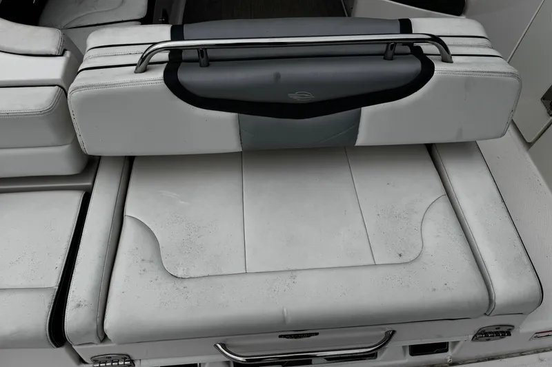 Slide: The Image of 2020 Chaparral 277 SSX boat seat with white upholstery and metal handle. - 7