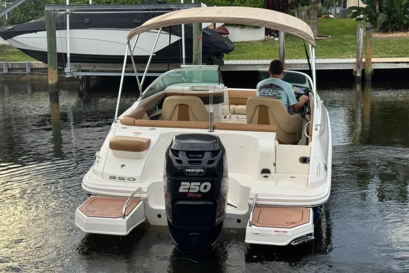 Slide: The Image of 2015 Sea Ray 220 Sundeck Outboard boat with Verado 250 Pro engine on water. - 14