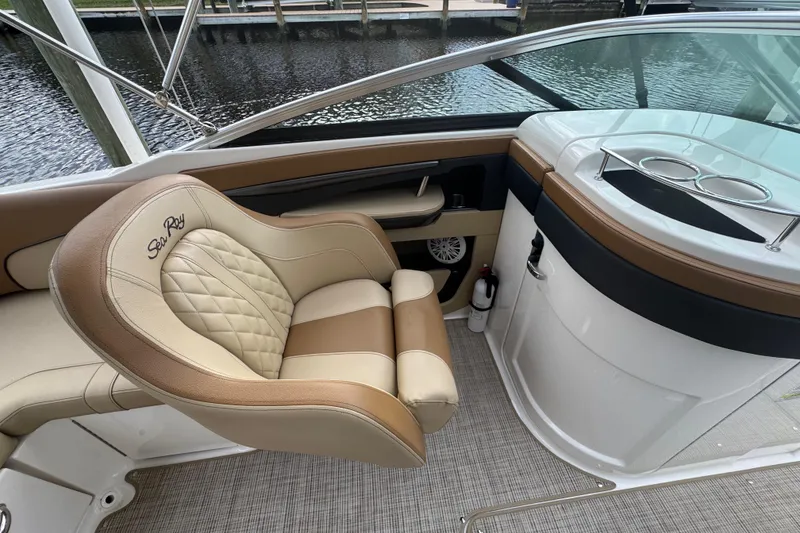 Slide: The Image of 2015 Sea Ray 220 Sundeck Outboard interior with luxurious seating and elegant design. - 21