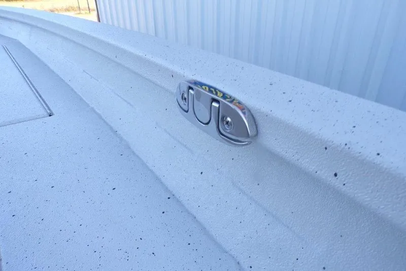 Slide: The Image of 2026 Xpress H20B Bay boat deck with cleat, textured surface. - 13